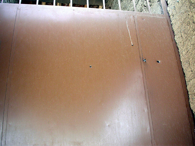 bullet hole in storeroom door